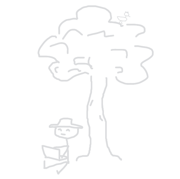 A lad sitting under a tree.